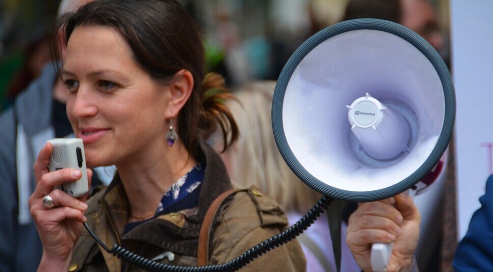 a woman holding a megaphone